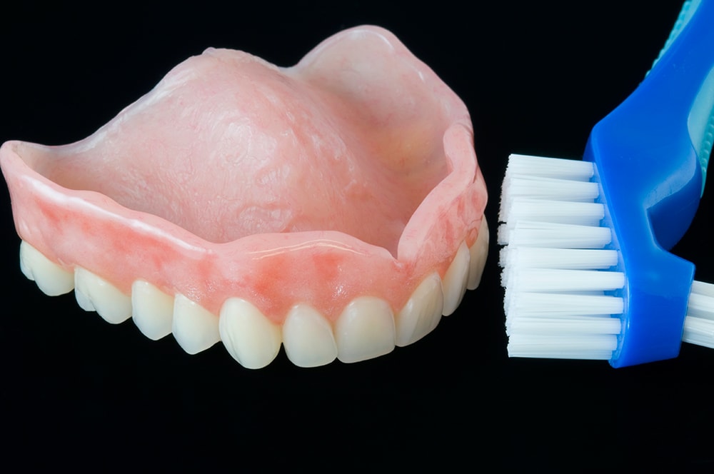 How to clean removable dentures.