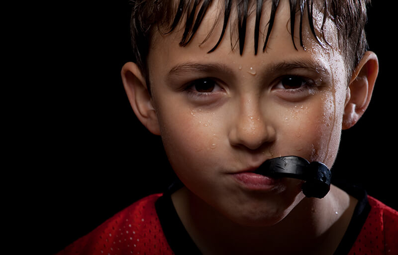 protect teeth with mouth guards when playing sports