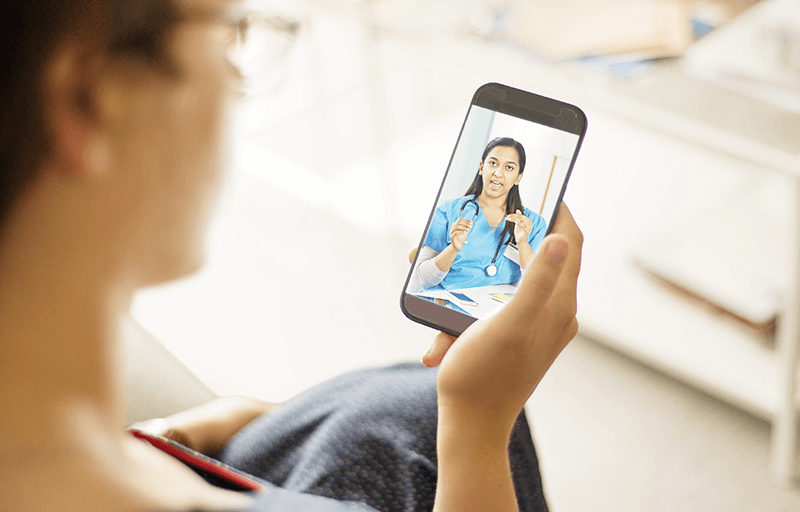 Woman video chatting with Doctor