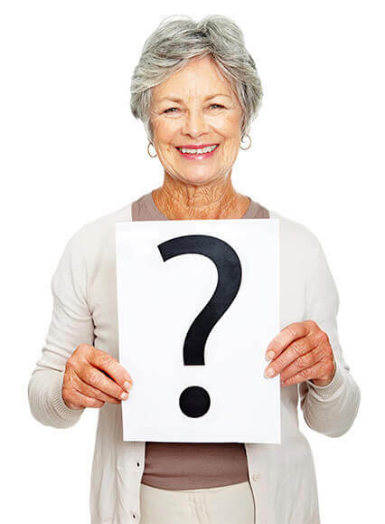 Woman holding sign with question mark