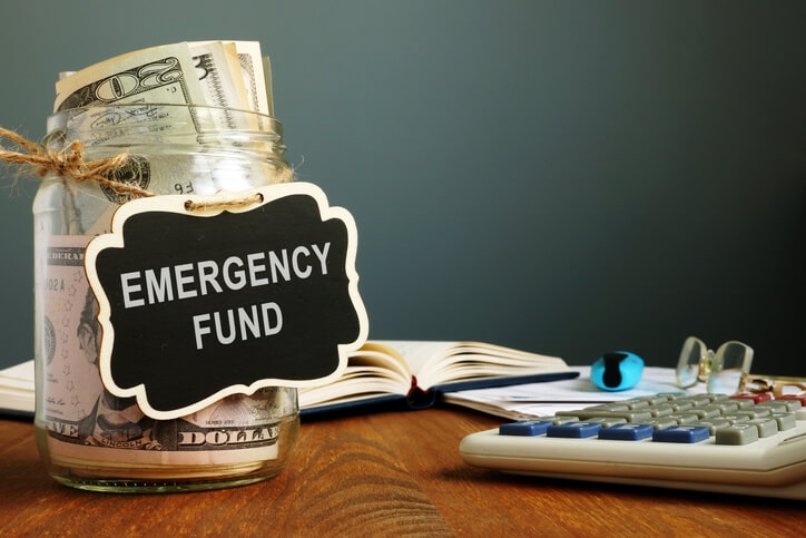money in a jar labelled emergency fund